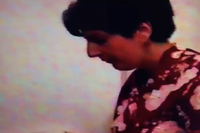 1990년대에 녹화된 VHS테이프 속 한 장면. 에제키엘이 첫째 아들의 기저귀를 갈고 있는 모습. (사진=일레븐랩스)